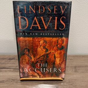 'The Accusers' Book - Black and Orange Cover